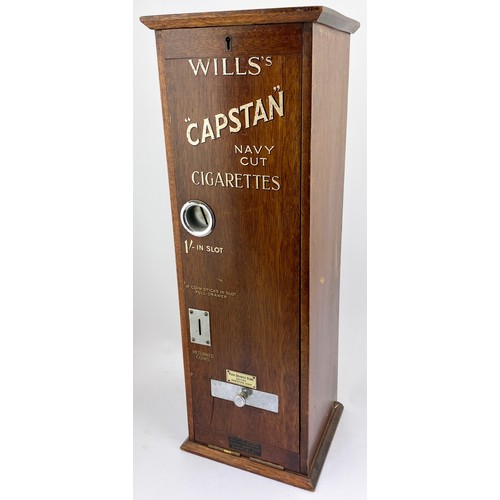 24 - WILLS CAPSTAN NAVY CUT CIGARETTE MACHINE. 23ins tall, 7ins wide, 8.25ins length. Wooden machine with... 