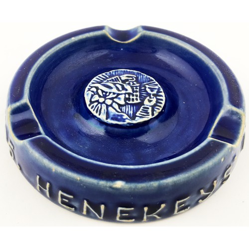 52 - HENEKEYS OLD WINE HOUSE ASHTRAY. 4.8ins diam. Dark blue stoneware glaze with pict. t.m. Various Doul... 