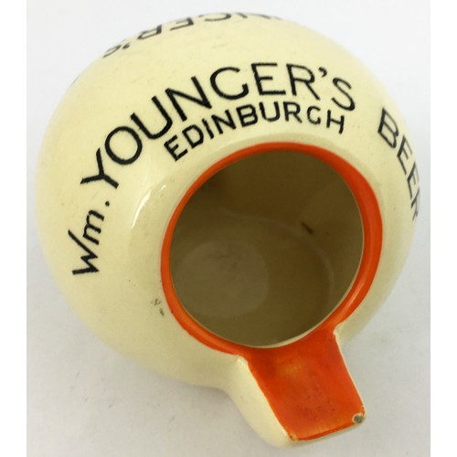 55 - Wm YOUNGERS BEER EDINBURGH ASHTRAY. 2.6ins tall. Unique (?) spherical shape with 2 protruding tongue... 