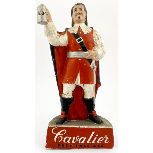 70 - CAVALIER BACKBAR FIGURE. 13ins tall. Rubberoid advertising figure of dapperly dressed man holding a ... 