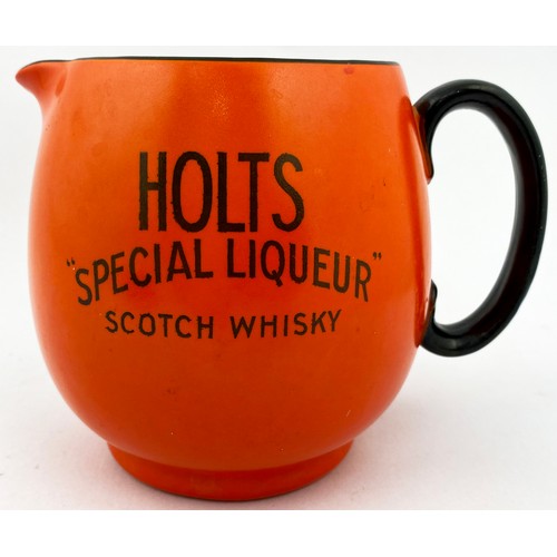 71 - HOLTS SCOTCH WHISKY WATER JUG. 5ins tall. Bright orange, black transfer to two sides HOLTS/ MOUNTAIN... 