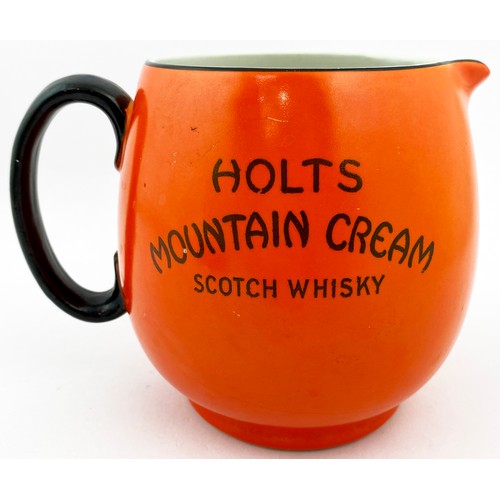 71 - HOLTS SCOTCH WHISKY WATER JUG. 5ins tall. Bright orange, black transfer to two sides HOLTS/ MOUNTAIN... 