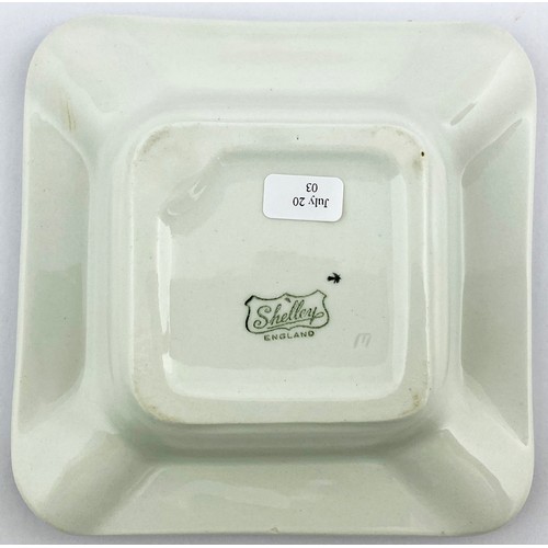 82 - BUCHANANS BLACK & WHITE ASHTRAY. 5ins diam. Square shape with pict of begging dogs to centre with re... 