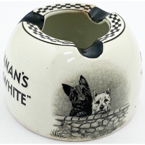 83 - BUCHANANS BLACK & WHITE ASHTRAY. 2.25ins tall. Rounded body. Dogs pict to both sides. Dogs stood beg... 