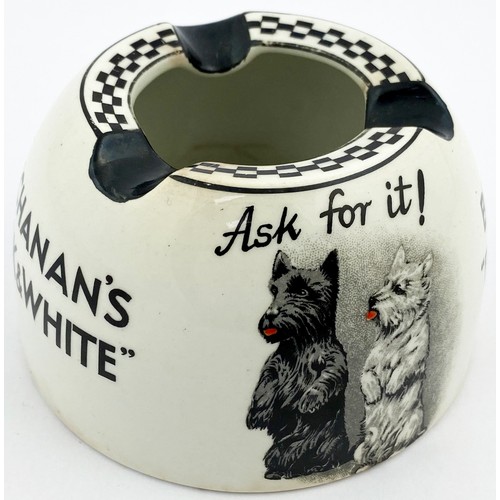 83 - BUCHANANS BLACK & WHITE ASHTRAY. 2.25ins tall. Rounded body. Dogs pict to both sides. Dogs stood beg... 