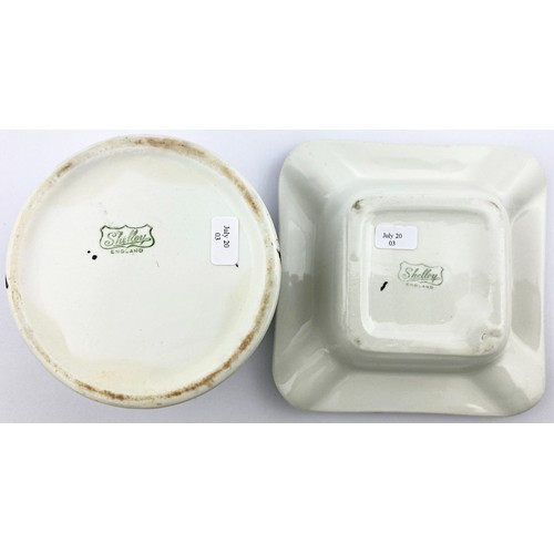 85 - LACK & WHITE  ASHTRAY DUO. Largest 5ins diam . One square other round bodied. Same images on both, d... 