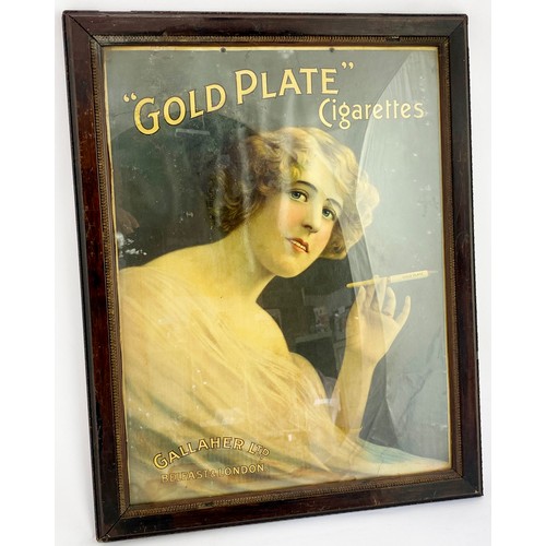 106 - GOLD PLATE CIGARETTES FRAMED ADVERT. 22 x 17.75ins. Wooden frame. Main image of lady smoking. Chippe... 