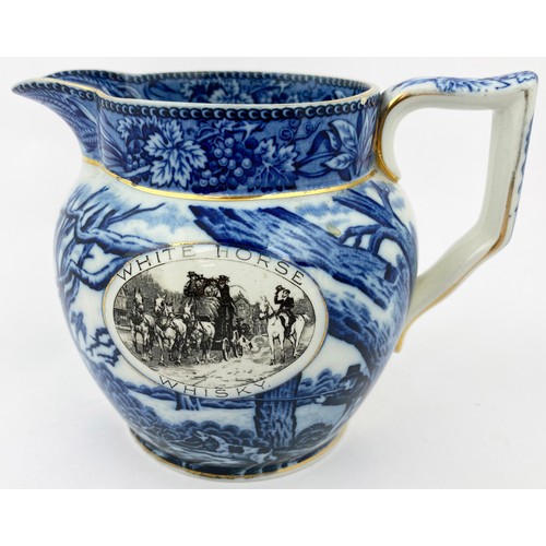 134 - WHITE HORSE WHISKY WATER JUG. 5 ins tall. Blue & white handled jug with gold edging, hunting scene, ... 