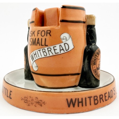 157 - WHITBREADS MATCHBOX HOLDER & ASHTRAY. 3.7ins tall. Central barrel shape supported by 2 labelled bott... 