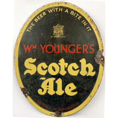 163 - WM YOUNGERS SCOTCH ALE ENAMEL SIGN. 14 x 18ins. Oval shape. THE BEER WITH A BITE IN IT. Coat of arms... 