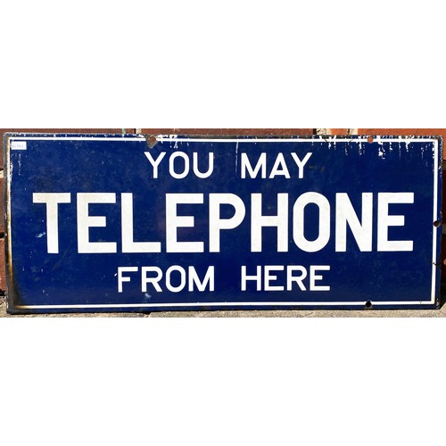 167 - YOU MAY TELEPHONE FROM HERE DOUBLE SIDED ENAMEL SIGN. 9 x 22ins. Rectangular, dark blue background, ... 