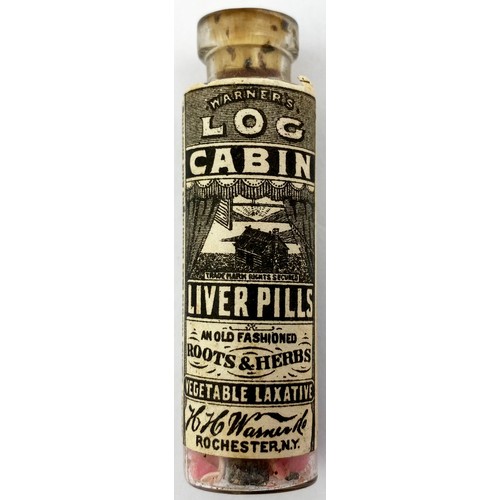 212 - WARNERS LOG CABIN LIVER PILLS. 2.25ins tall. Clear glass bottle with original pictorial paper label ... 