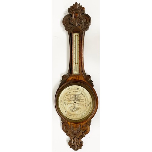 218 - LONDON ADVERTISING BAROMETER. 34.5 x 10ins tall. Most attractive wooden carved barometer with centra... 