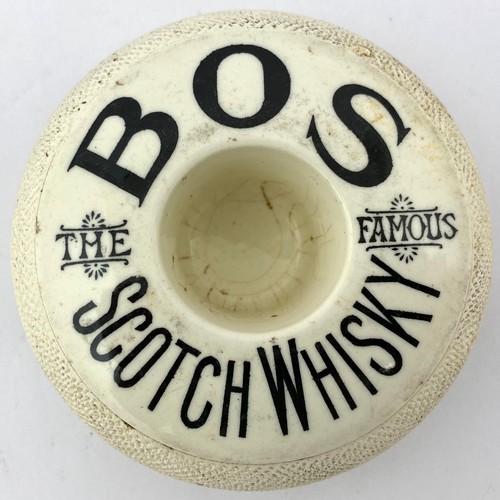 227 - BOS SCOTCH WHISKY TYRE SHAPED MATCHOLDER & STRIKER. 4.5ins diam. Off white, black transfer BOS/ THE ... 