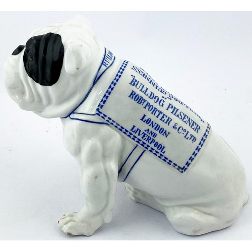 307 - BULLDOG GUINNESS FIGURE. 7ins tall. All white characterful seated bulldog some black patches, blue l... 