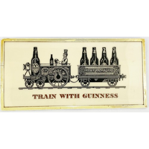 310 - EARLY GUINNESS PERSPEX PIECE. 5.5 x 11ins. Guinness train pulling cart with bottles in GREAT RAILWAY... 