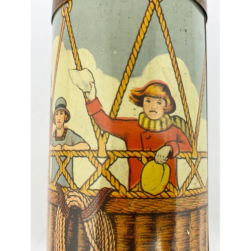 271 - LYONS TOFFEE TIN. 5ins tall. Hot air balloon image with various passengers in the basket. Initials J... 