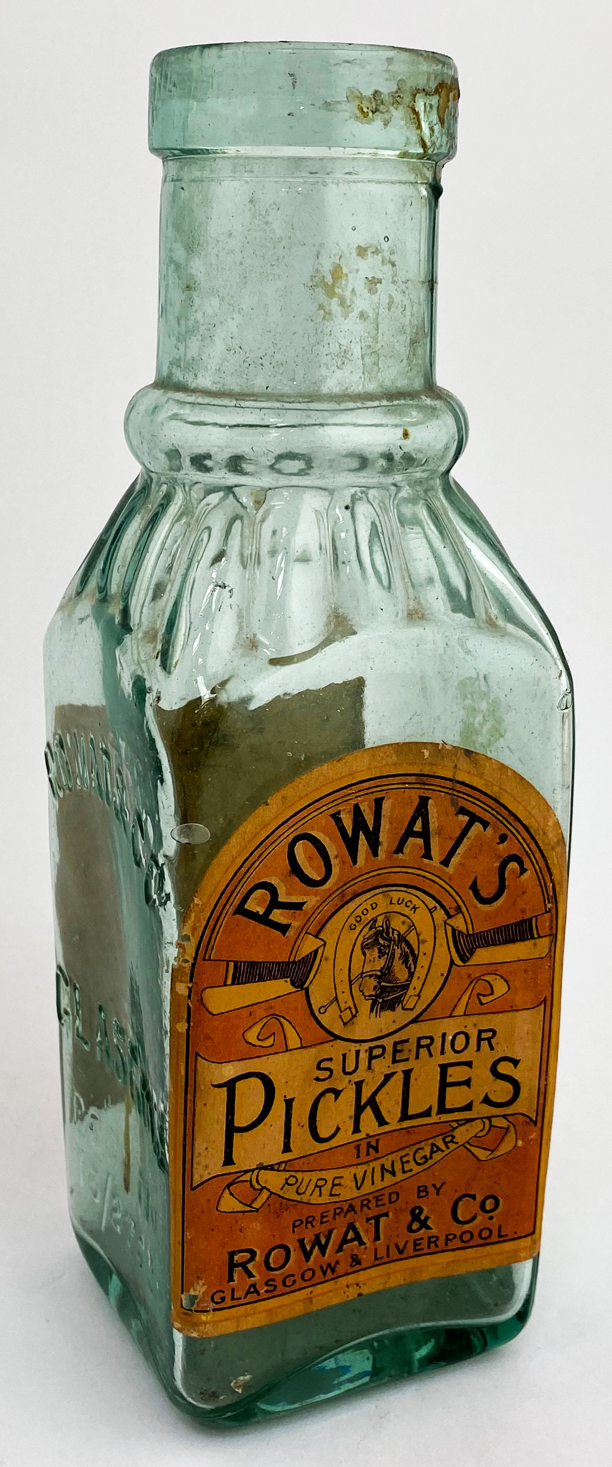 ROWATS LABELLED PICKLE JAR. 9.5ins tall. Aqua glass, neck ribbing