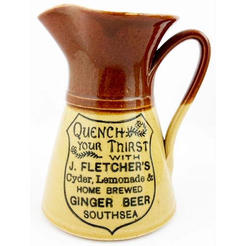 62 - SOUTHSEA WATER JUG. 5.3ins tall. T,t., waisted form, side handle. Dark drown top, lower tan. Shield ... 