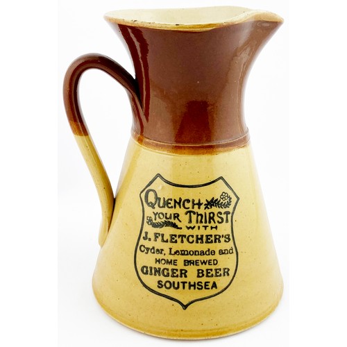 63 - SOUTHSEA WATER JUG. 8.2ins tall. T,t., waisted form, side handle. Dark drown top, lower tan. Shield ... 