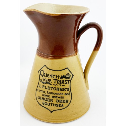 63 - SOUTHSEA WATER JUG. 8.2ins tall. T,t., waisted form, side handle. Dark drown top, lower tan. Shield ... 