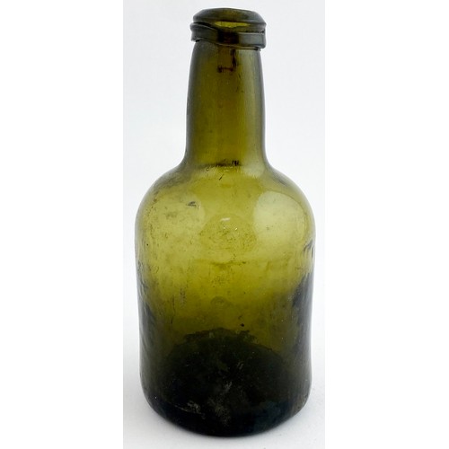 212 - SPLIT SIZE CYLINDER WINE BOTTLE. 6.6ins tall. Dark green glass, black where thickest, short neck wit... 