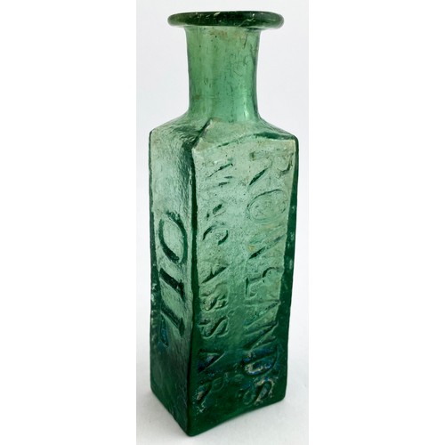 215 - ROWLANDS MACASSAR OIL BOTTLE. 3.7ins tall. Turquoise green glass colour, flattened rectangular body ... 