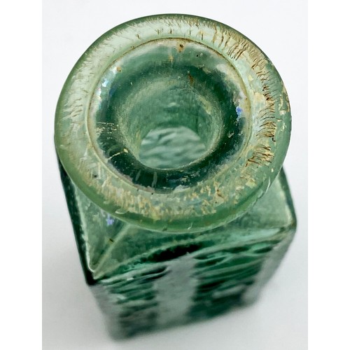 215 - ROWLANDS MACASSAR OIL BOTTLE. 3.7ins tall. Turquoise green glass colour, flattened rectangular body ... 