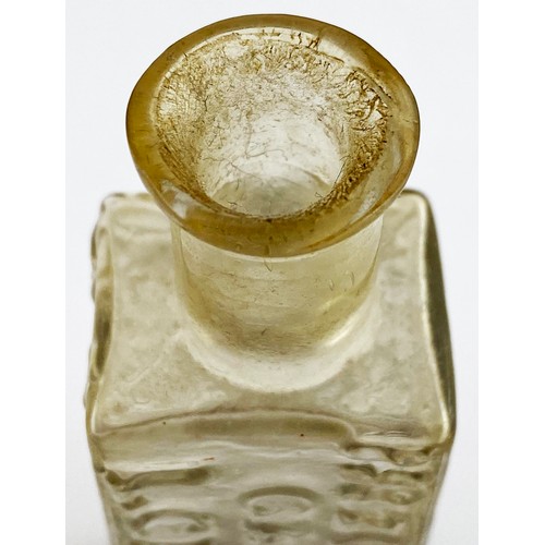 216 - ROWLANDS MACASSAR OIL BOTTLE. 3.8ins tall. Clear flint glass, flattened rectangular body, short neck... 