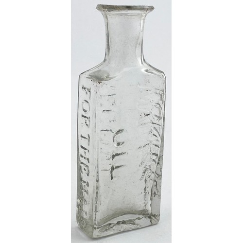 217 - ROWLANDS MACASSAR OIL BOTTLE. 3.6ins tall. Bright clear flint glass, flattened rectangular body, sho... 