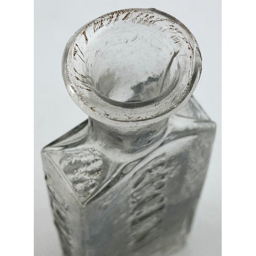 217 - ROWLANDS MACASSAR OIL BOTTLE. 3.6ins tall. Bright clear flint glass, flattened rectangular body, sho... 