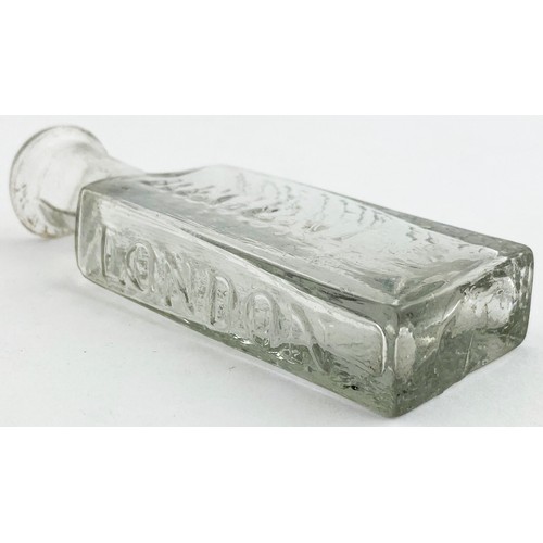 217 - ROWLANDS MACASSAR OIL BOTTLE. 3.6ins tall. Bright clear flint glass, flattened rectangular body, sho... 