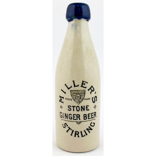 221 - STIRLING GINGER BEER BOTTLE. 8.5ins tall, ch. Cobalt blue lip, Black transfer MILLERS/STONE GINGER B... 