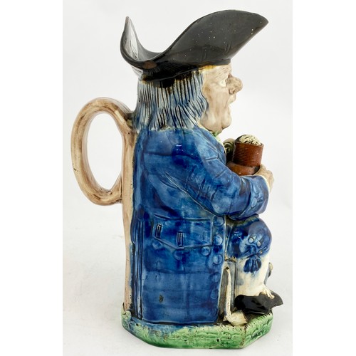 339 - STAFFORDSHIRE TOBY JUG. 10ins tall. Blue & green glaze figure of seated man with a beer. In manufact... 