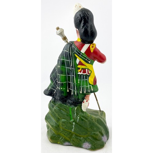 54 - DEWARS WHISKIES BACK BAR ADVERTISING FIGURE. 10ins tall. Rubberoid figure of kilted man. Base filled... 