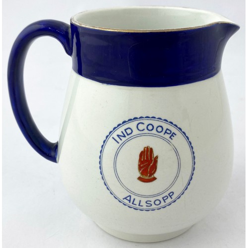 79 - IND COOPE ALLSOPP WATER JUG. 4.5ins tall. Double sided transfer of church ? & hand, faded gold rim. ... 