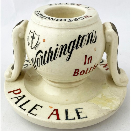 101 - WORTHINGTONS PALE ALE MATCHSTRIKER/ ASHTRAY. 3.75ins tall. Ball shaped striker on a saucer type base... 