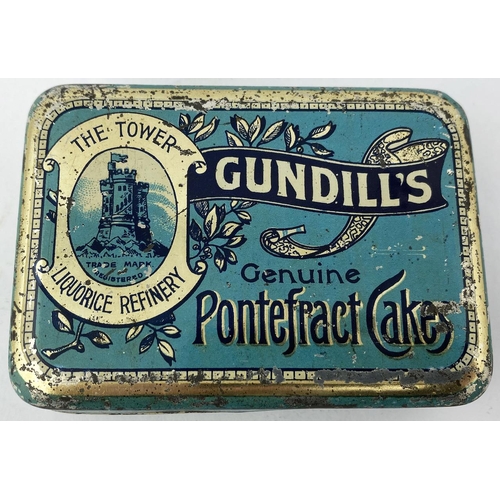 327 - GUNDILLS GENUINE PONTEFRACT CAKES. 2.9 x 4.1 x 1.2ins. Generally good condition, some surface & edge... 