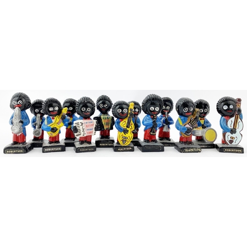 332 - ROBERTSONS GOLLY BAND. A set of thirteen Robertson golly band figurinesplaying various musical instr... 