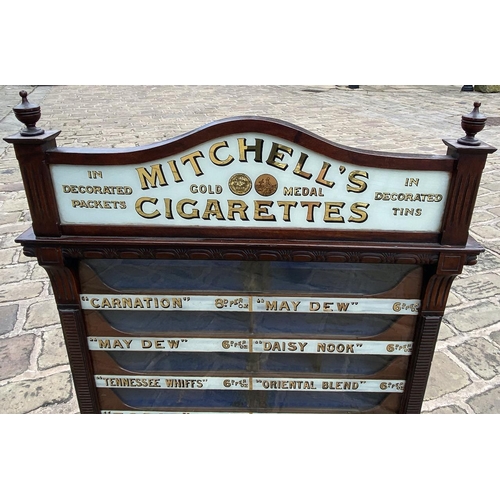 340 - MITCHELLS CIGARETTES SHOP VENDING CABINET. 36 x 27 x 6ins. A highly decorative narrow bodied , glass... 