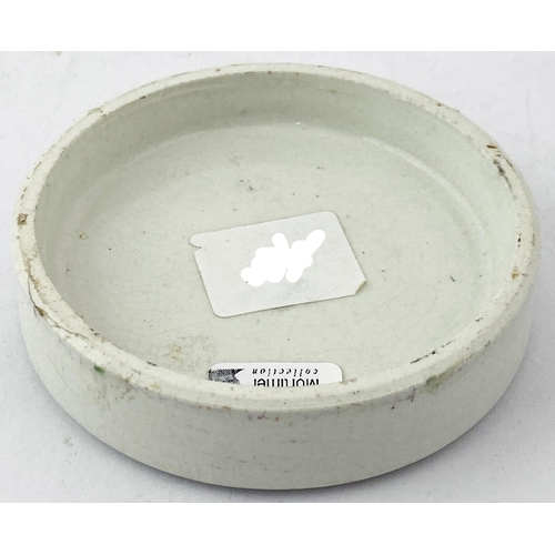 11 - HARROGATE OTTO OF ROSE COLD CREAM POT LID. 2.9ins diam. Striking outer border design around eight li... 