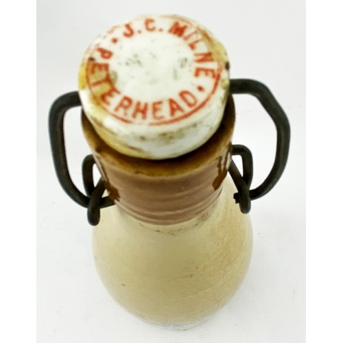 16 - ABERDEEN GINGER BEER BOTTLE. 9ins tall, ch.,tan lip, swing stopper. Shapely bordered shield transfer... 