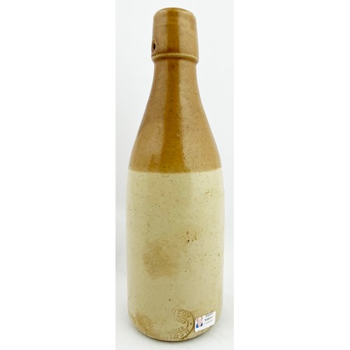 19 - IRVINE GINGER BEER BOTTLE.8.5ins tall, ch., t.t., swing stopper closure. The impressed lines of writ... 