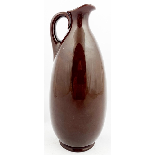 49 - MACNAB KINGSWARE WHISKY JUG. JL p30. 9ins tall. Familiar elongated pear shape, raised multicoloured ... 