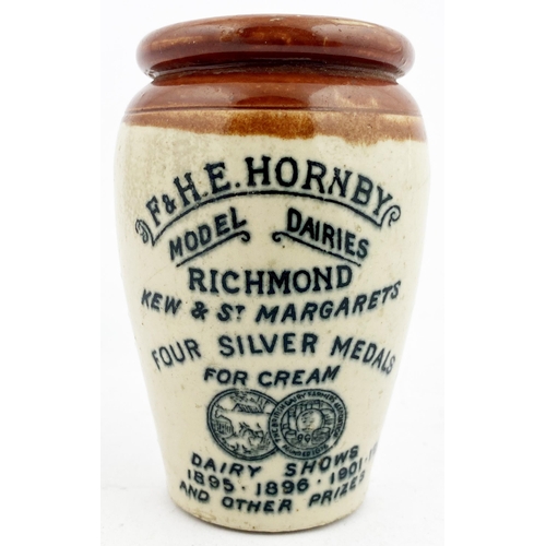 73 - RICHMOND CREAM POT. 3.6ins tall. Red brown top, off white body. Strong black front transfer with gol... 