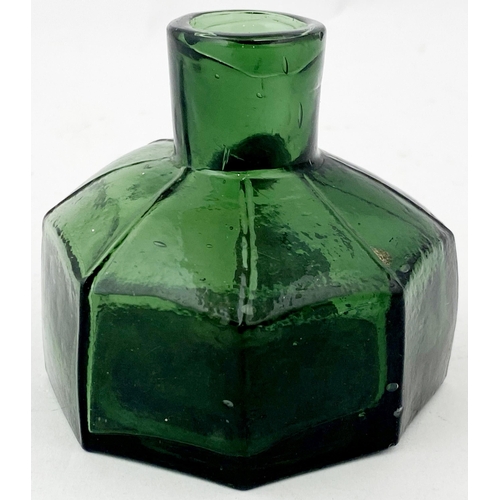 53 - OCTAGONAL INK BOTTLE. 2.2ins tall. Squat tooled lip, deep green glass, unusual delineated shoulders.... 