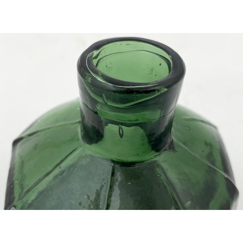 53 - OCTAGONAL INK BOTTLE. 2.2ins tall. Squat tooled lip, deep green glass, unusual delineated shoulders.... 