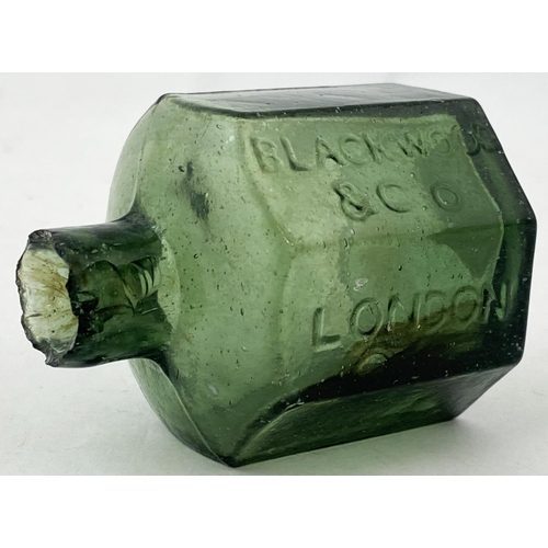 57 - BLACKWOOD & CO INK BOTTLE. 2.2ins tall. A hard to find olive green glass London octagonal. Mid olive... 