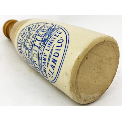 91 - LLANDILO GINGER BEER BOTTLE. 8ins tall., t.t.,ch. Strong blue transfer with floral central t.m. HOP ... 