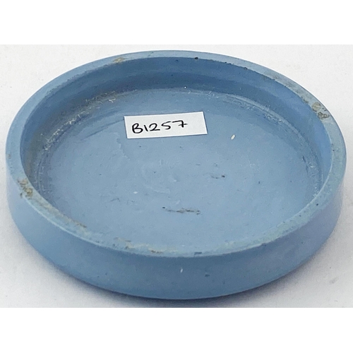 124 - CARBOLINE POT LID. 3.15ins diam. Mid blue coloured pot lid with black transfer featuring decorative ... 